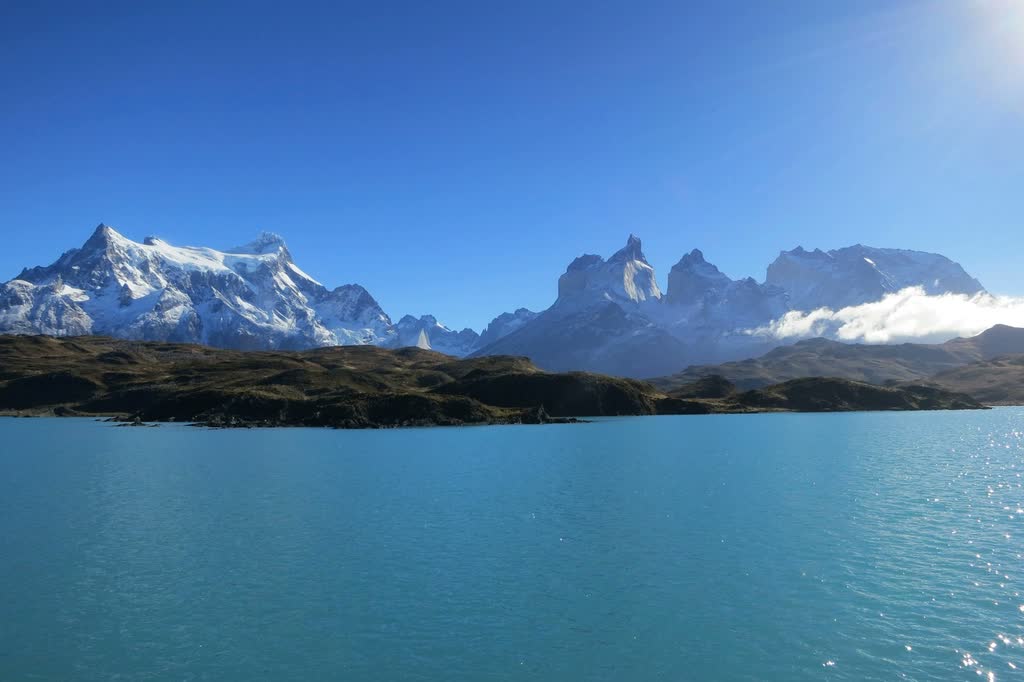 Snow-capped Cuernos del Paine rising over a turquoise lake in Torres del Paine